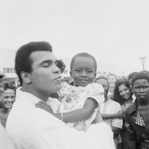 Muhammad Ali with a small child